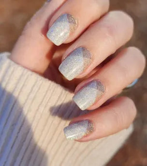 Beige with Details of gray and tan. On the nails. Color Street nail strips.